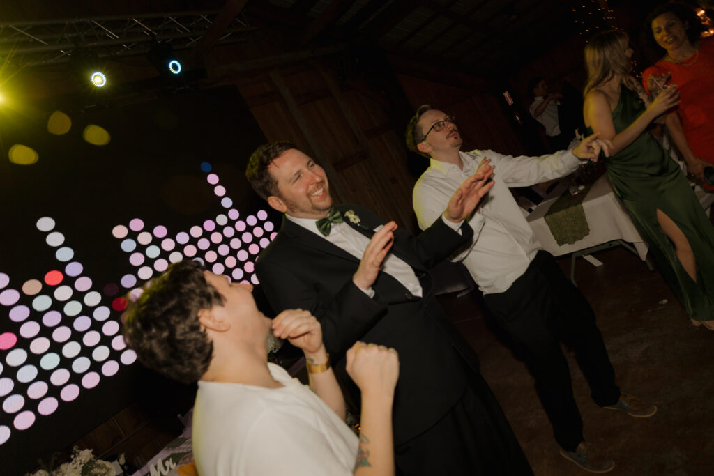 Wedding guests dancing during the reception at Destiny Ranch Events