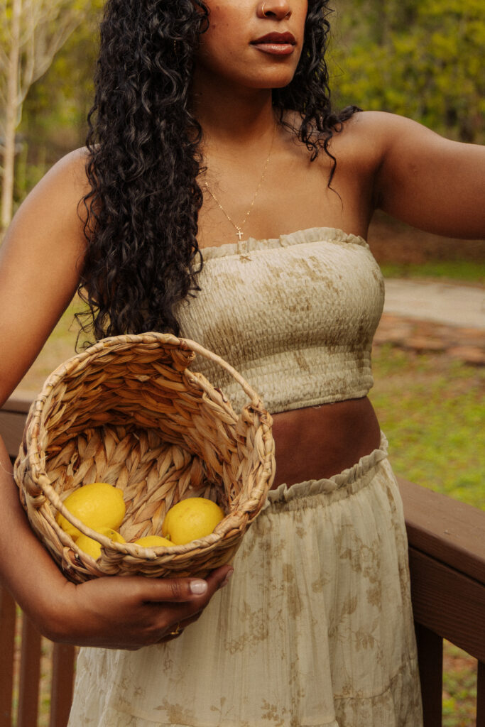 Holistic wellness professional holding a basket of lemons during her Sholom Park branding session
