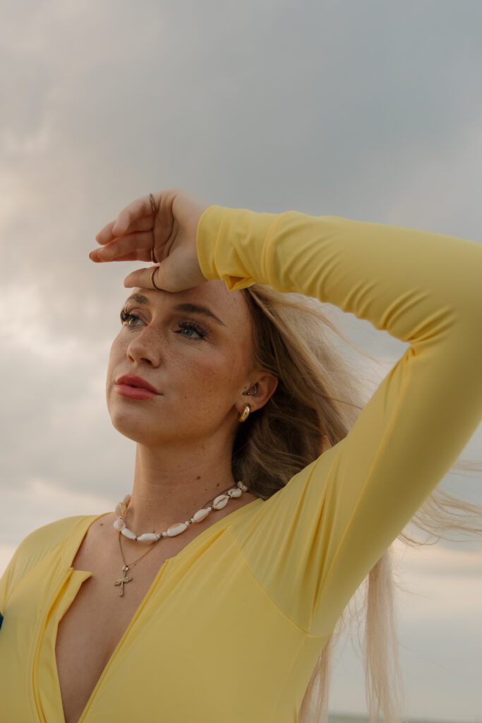 Woman posing in the Gulf water during a surfer inspired photoshoot in Clearwater Florida