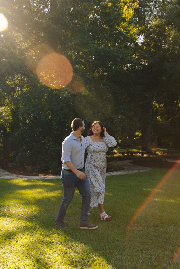 Couple walking together during engagement photos in Ocala, Florida