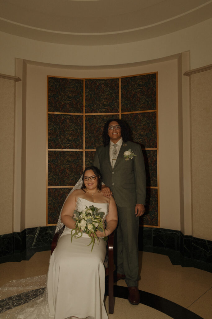 Bride and groom posing together after their Orange County Courthouse wedding ceremony