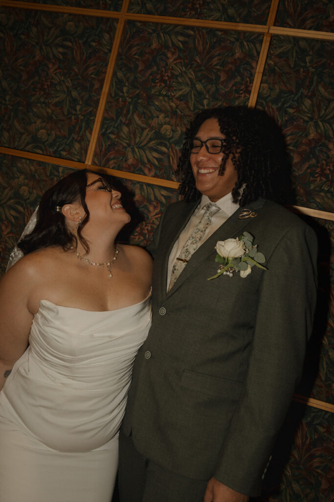 Bride and groom laughing together during their intimate Orlando courthouse elopement
