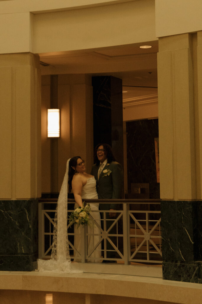 Newlyweds sharing a candid moment inside the Orange County Courthouse in Orlando Florida