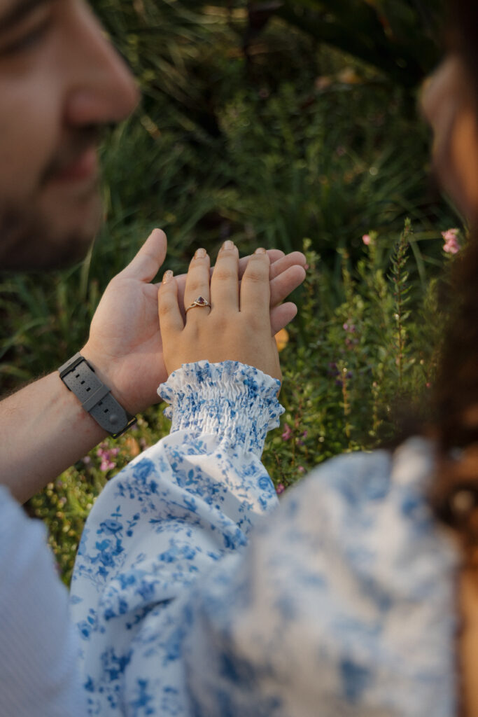 Couple holding hands during a Sholom Park engagement session in Ocala