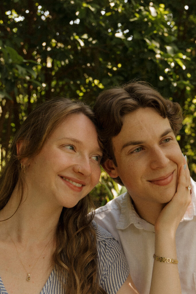 Engaged couple smiling together during their Sholom Park engagement session in Ocala